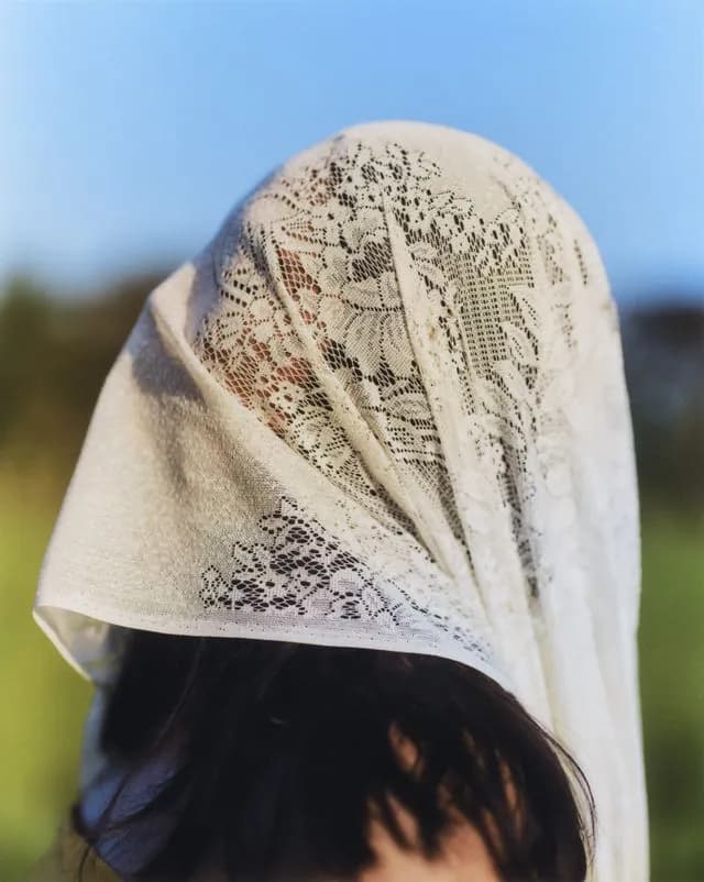 Woman with Lace Scarf - Close-up of woman wearing delicate lace headscarf